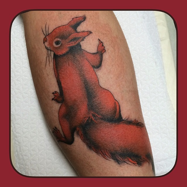 Squirrel tattoo on the left thigh.