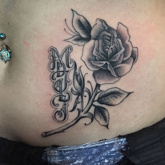 yesterday @paintlinetattoo,
 i did a small rose and a 5 letter monogram @leawiep